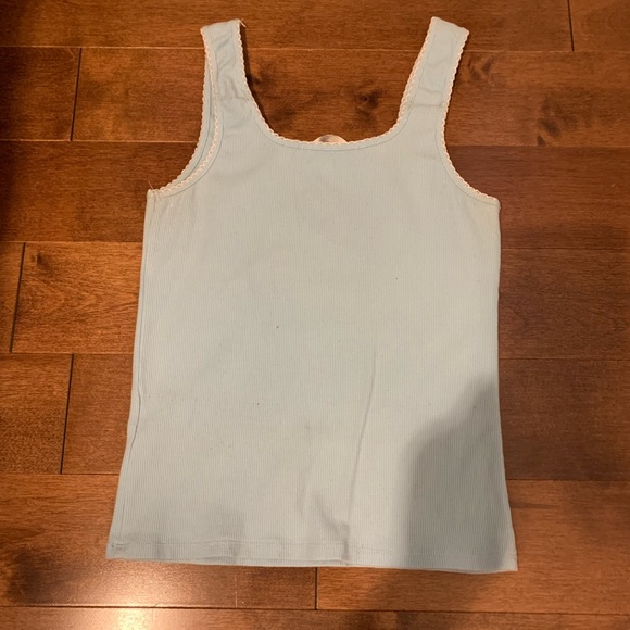Light blue tank top with white sunflower in the center. Still in good condition - Picture 2 of 2